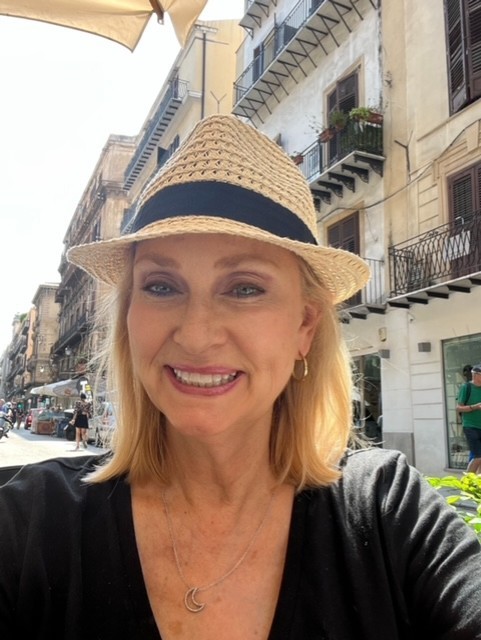 Bev Meech, life coach, wearing a hat