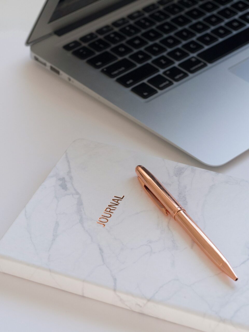 journal and laptop